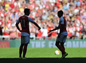 Arsenal v Chelsea - Community Shield 2015-16 Collection: Arsenal's Star Duo: Ozil and Walcott Shine at the FA Community Shield vs. Chelsea (2015)