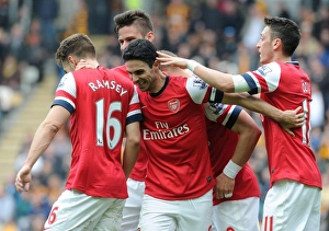 Arsenal's Stars: Podolski, Ramsey, Ozil, and Giroud Celebrate Goals Against Hull City (April 2014)