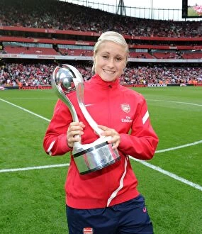 Images Dated 10th September 2011: Arsenal's Stephy Houghton Celebrates WSL Title Win with Trophy at Arsenal vs