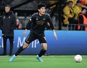 Bodø/Glimt V Arsenal 2022-23 Prints: Arsenal's Takehiro Tomiyasu in Action against Bodø/Glimt in UEFA Europa League