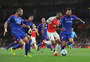 Arsenal's Theo Walcott Battles Olympiacos Defenders