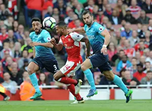 Arsenal V Swansea City 2016-17 Prints: Arsenal's Theo Walcott Battles Swansea Defenders in Intense Clash