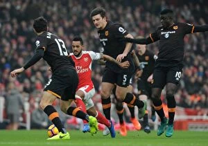Images Dated 11th February 2017: Arsenal's Theo Walcott Clashes with Hull Defenders during Premier League Match
