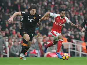 Arsenal V Hull City 2016-17 Prints: Arsenal's Theo Walcott Clashes with Hull's Harry Maguire in Premier League Showdown