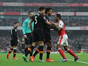 Images Dated 11th February 2017: Arsenal's Theo Walcott Stands Firm Against Hull City's Maguire and Huddlestone