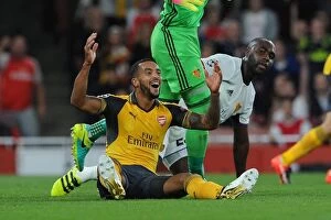 Arsenal v FC Basel 2016-17 Collection: Arsenal's Theo Walcott vs. Eder Balanta: A Penalty Dispute in the UEFA Champions League Clash