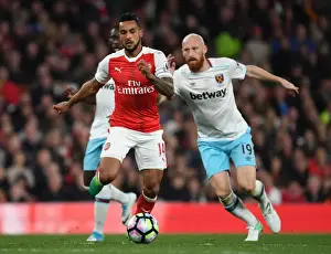 Arsenal V West Ham United 2016-17 Prints: Arsenal's Theo Walcott vs. West Ham's James Collins: A Premier League Battle at Emirates Stadium