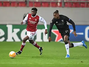 Arsenal V SL Benfica 2020-21 Prints: Arsenal's Thomas Partey Clashes with Benfica's Nuno Tavares in Europa League Showdown