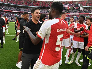 Arsenal V Manchester City - Community Shield 2023-24 Prints: Arsenal's Thomas Partey and Mikel Arteta Celebrate FA Community Shield Victory over Manchester City