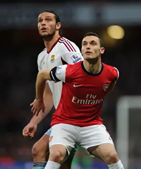 Arsenal's Thomas Vermaelen Holds Off Andy Carroll in Intense Arsenal v West Ham United Clash
