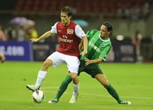Arsenal's Tomas Rosicky Faces Off Against Vazquez in Hangzhou Friendly