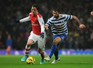 Arsenal V Queens Park Rangers 2014-15 Prints: Arsenal's Tomas Rosicky Outmaneuvers QPR's Charlie Austin during the 2014-15 Premier League Match