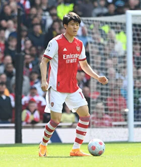 Images Dated 23rd April 2022: Arsenal's Tomiyasu in Action: Arsenal vs Manchester United, Premier League 2021-22, Emirates Stadium