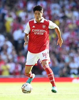 Arsenal v Leicester City 2022-23 Collection: Arsenal's Tomiyasu in Action against Leicester City - Premier League 2022-23