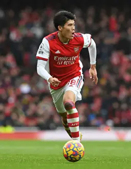 Arsenal V Newcastle United 2021-22 Prints: Arsenal's Tomiyasu in Action Against Newcastle United - Premier League 2021-22