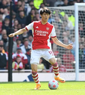 Arsenal v Manchester United 2021-22 Collection: Arsenal's Tomiyasu in Action: Premier League Showdown against Manchester United at Emirates Stadium