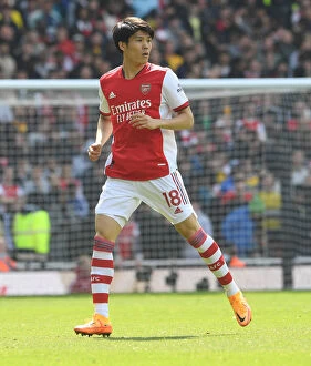 Images Dated 23rd April 2022: Arsenal's Tomiyasu in Action: Premier League Clash Against Manchester United at Emirates Stadium