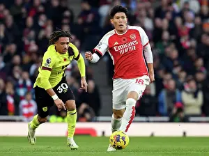 Arsenal's Tomiyasu Fends Off Burnley's Koleosho: Premier League Clash at Emirates Stadium (2023-24)