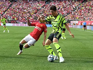 Arsenal V Manchester United - Pre Season 2023-24 Prints: Arsenal's Tomiyasu Goes Head-to-Head with Manchester United's Antony in Pre-Season Showdown