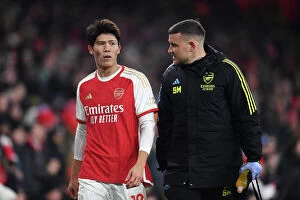 Arsenal v Wolverhampton Wanderers 2023-24 Collection: Arsenal's Tomiyasu Suffers Injury in Arsenal vs. Wolverhampton Clash (2023-24)
