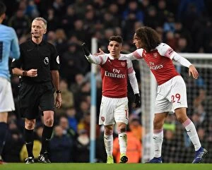 Manchester City v Arsenal 2018-19 Collection: Arsenal's Torreria and Guendouzi Protest Referee Decision During Manchester City vs Arsenal