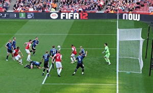 Arsenal's Triumph: Crowded Emirates Goalmouth Seces Arsenal's 3-1 Victory Over Stoke City in the Premier League (2011-2012)