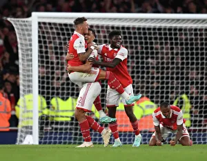 Arsenal's Triumph: Celebrating with White, Saliba, and Partey after Arsenal v Liverpool (2022-23)