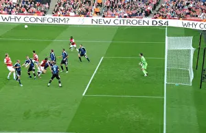 Arsenal's Triumph: Crowded Penalty Area as Arsenal Leads 3-1 Over Stoke City in Premier League (2011-2012)