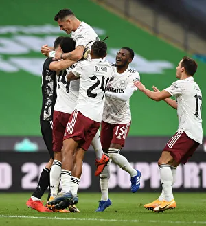 Arsenal's Triumph: Emi Martinez, Xhaka, and Maitland-Niles Celebrate FA Community Shield Victory over Liverpool in Penalty Shootout
