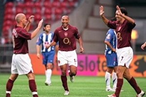 Arsenal's Triumph: Henry, Pires, Ljungberg Celebrate Win Against Porto at the Amsterdam Tournament (2005)