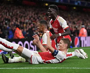 Arsenal's Triumph: Jesus, Odegaard, and Saka Celebrate 3rd Goal vs. PSV Eindhoven (UEFA Champions League 2023/24)