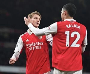 Arsenal v Everton 2022-23 Collection: Arsenal's Triumph: Odegaard and Saliba Celebrate Third Goal vs. Everton (2022-23)
