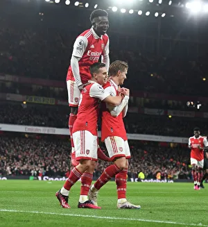 Arsenal's Triumph: Odegaard, Trossard, and Saka Celebrate 3rd Goal vs. Everton (2022-23)