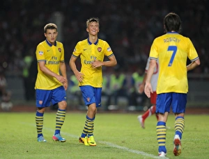 Indonesia Dream Team V Arsenal 2013-14 Prints: Arsenal's Triumph: Olsson, Rosicky, and Eisfeld Score in Indonesia All-Stars Clash