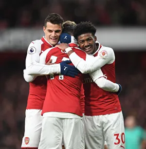 Arsenal V Newcastle United 2017-18 Prints: Arsenal's Triumph: Ozil, Xhaka, Maitland-Niles in Unison - Goal Celebration (2017-18)