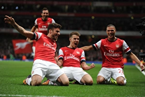 Arsenal's Triumph: Ramsey, Giroud, and Gibbs Celebrate Goals Against Liverpool (2013-14)