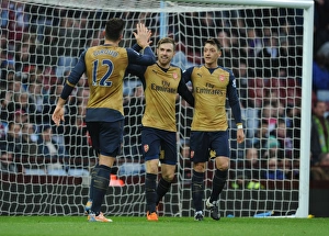 Arsenal's Triumph: Ramsey, Ozil, and Giroud's Goal Celebrations vs. Aston Villa (December 2015)