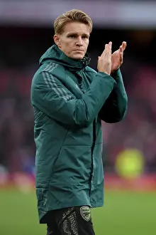 Arsenal's Triumph Over Sheffield United: Martin Odegaard Celebrates at Emirates Stadium (2023-24)
