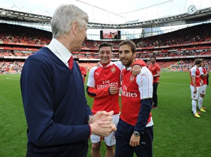 Arsenal's Triumph: Wenger, Ozil, and Flamini Celebrate Victory Over Aston Villa (2015-16)