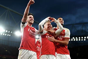 Arsenal v Burnley 2023-24 Collection: Arsenal's Triumph: Zinchenko, Rice, and Saliba Celebrate Third Goal vs Burnley (2023-24)