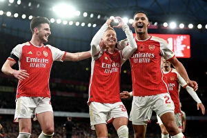 Images Dated 11th November 2023: Arsenal's Triumph: Zinchenko, Rice, and Saliba's Euphoric Celebration after Scoring the Third Goal
