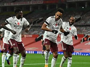 Arsenal's Triumphant Three: Aubameyang, Partey, Lacazette Celebrate Goal at Empty Old Trafford (2020-21)