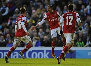 Arsenal's Triumphant Threesome: Walcott, Ramsey, and Giroud Celebrate FA Cup Goals against Brighton