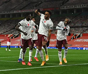 Arsenal's Triumphant Trio: Aubameyang, Partey, Lacazette - Celebrating a Goal at Manchester United (2020-21)