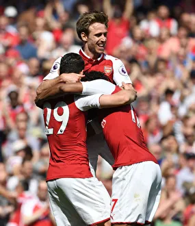 Arsenal's Triumphant Trio: Monreal, Iwobi, Xhaka's Euphoric Celebration vs. West Ham United (2017-18)