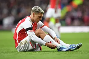 Arsenal's Trossard Adjusts Socks During Arsenal v Sheffield United, Premier League 2023-24