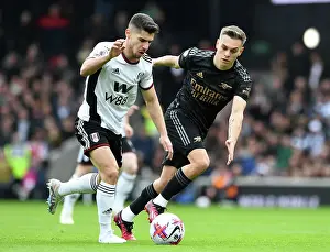 Arsenal's Trossard Closes In on Fulham's Solomon in Premier League Clash