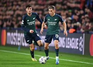 PSV Eindoven V Arsenal 2023-24 Prints: Arsenal's Trossard Dashes Through PSV Eindhoven's Defense in 2023-24 UEFA Champions League Clash