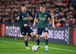 Images Dated 12th December 2023: Arsenal's Trossard Dashes Through PSV Eindhoven's Defense in 2023-24 UEFA Champions League Clash