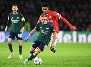 PSV Eindoven V Arsenal 2023-24 Prints: Arsenal's Trossard Faces Off Against PSV's Tillman in Champions League Clash